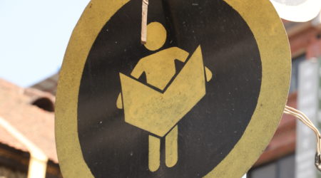 Newspaper Road Sign