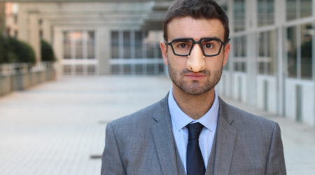 Businessman wearing fake nose-glasses combo
